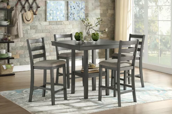Sharon counter height dining set includes four chairs and useful table-top display storage. The transitional design of this set is enhanced by the mindy veneer's medium-tone gray finish and the collection's profile's unstructured lines. The comfortable seats are covered in neutral-tone fabric, and the base of the table has a built-in display shelf that makes it easy and practical to store displays. From Mazin, 5659 from Homebay Furniture.